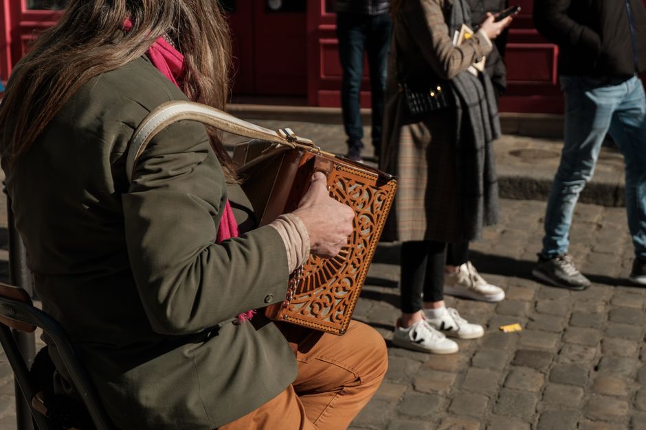 An accordion player, illustrative street-music photograph