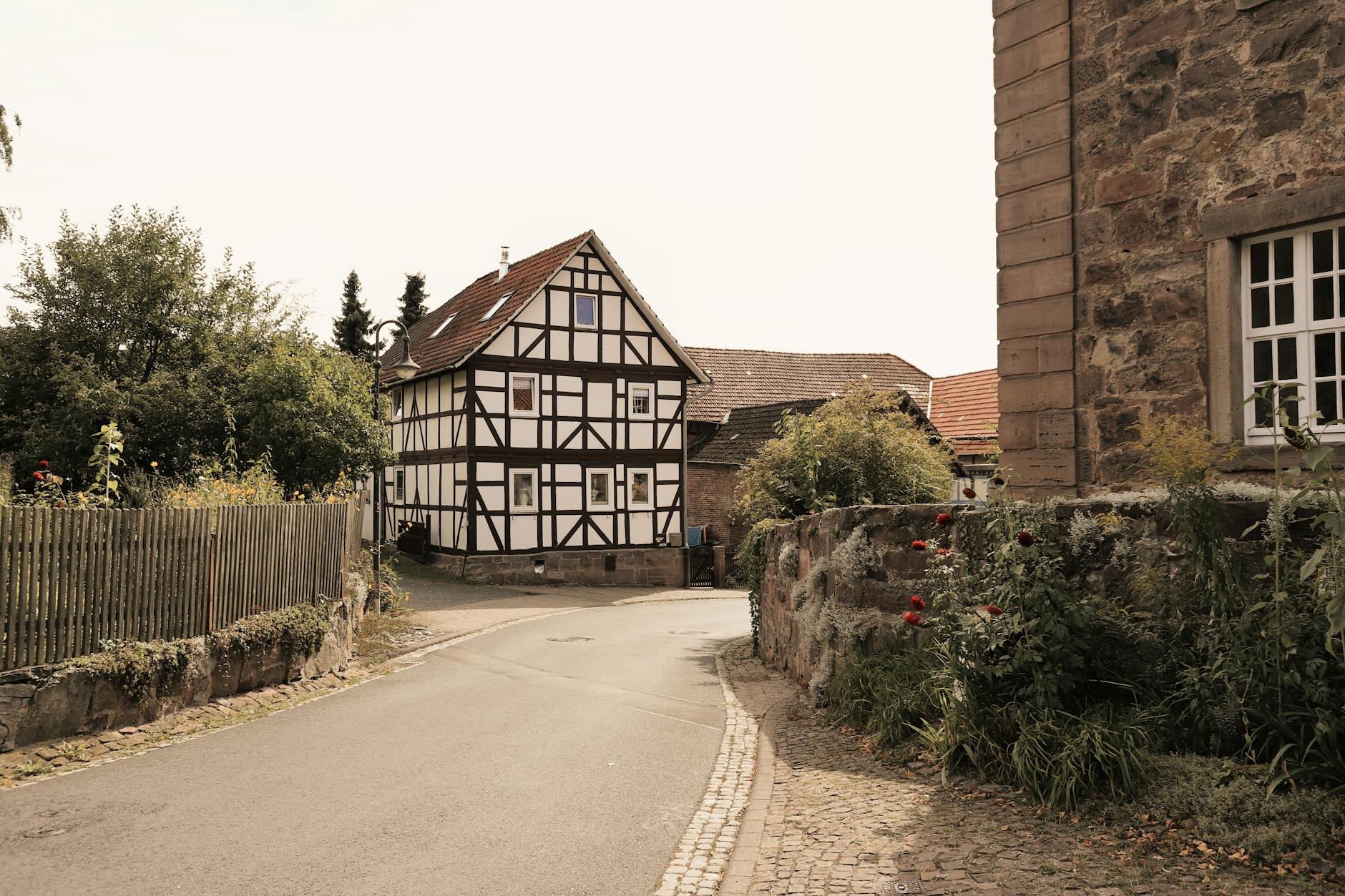 Charming timbered house and stone architecture in a quaint German village setting.