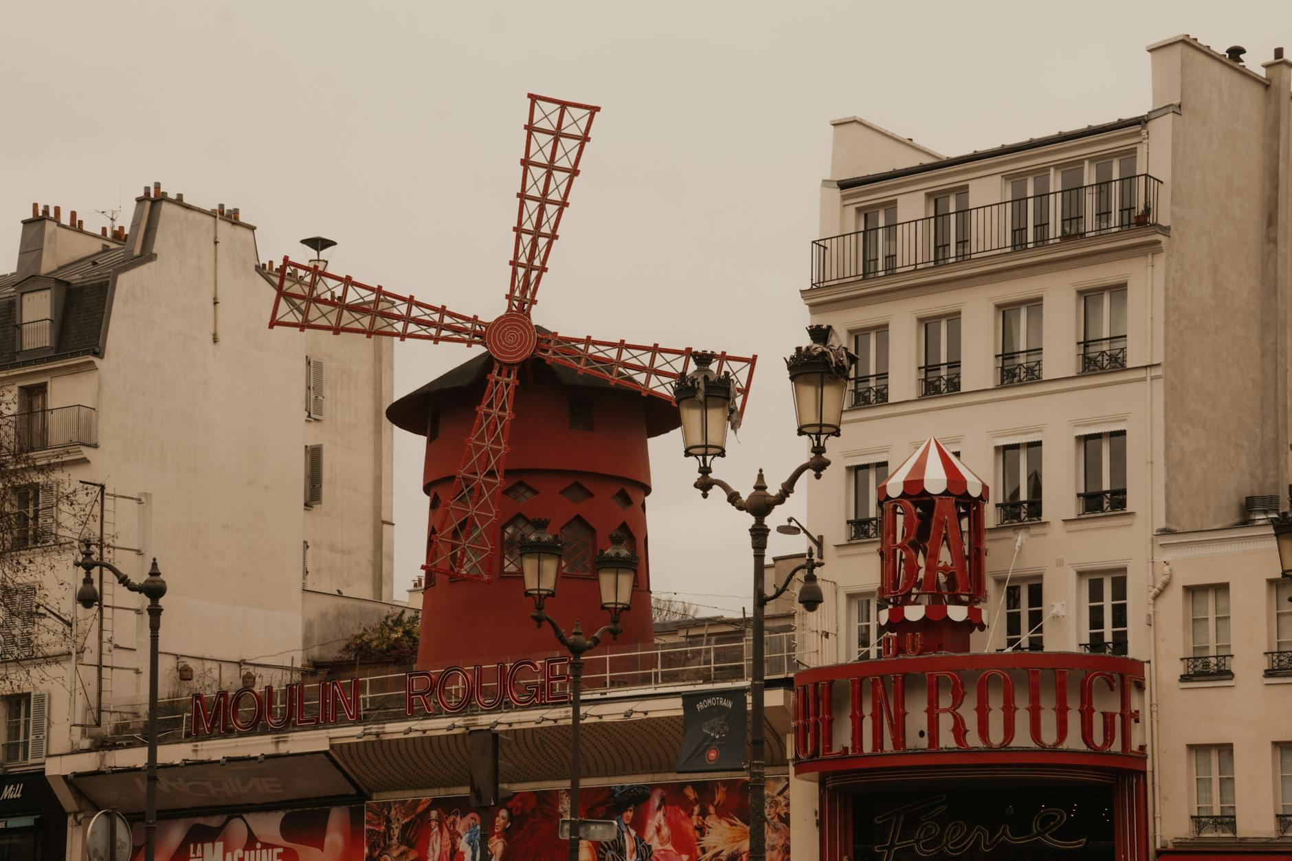 Capture of the historic Moulin Rouge in Montmartre, Paris, showcasing its famous red windmill.