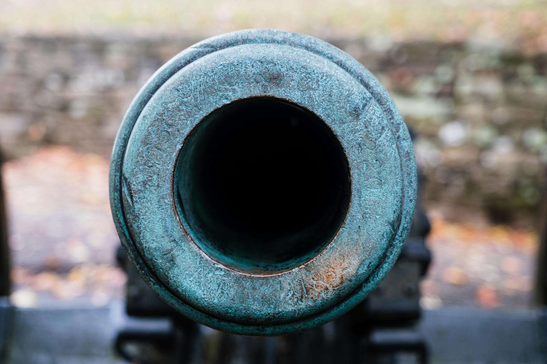 Detailed shot of a historic cannon barrel with patina.