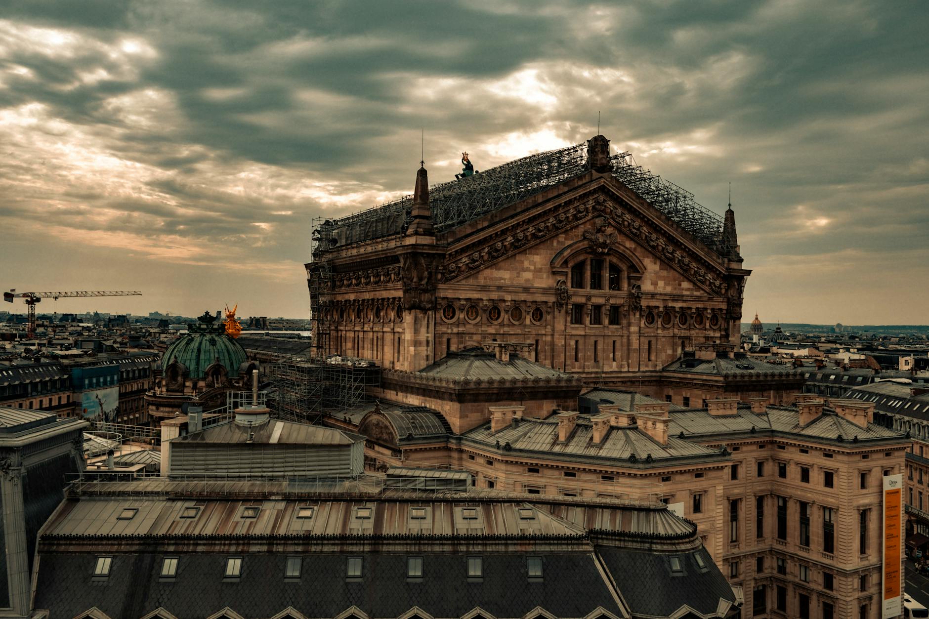 Aerial view of Paris' historic Opera building with stunning sunset light.