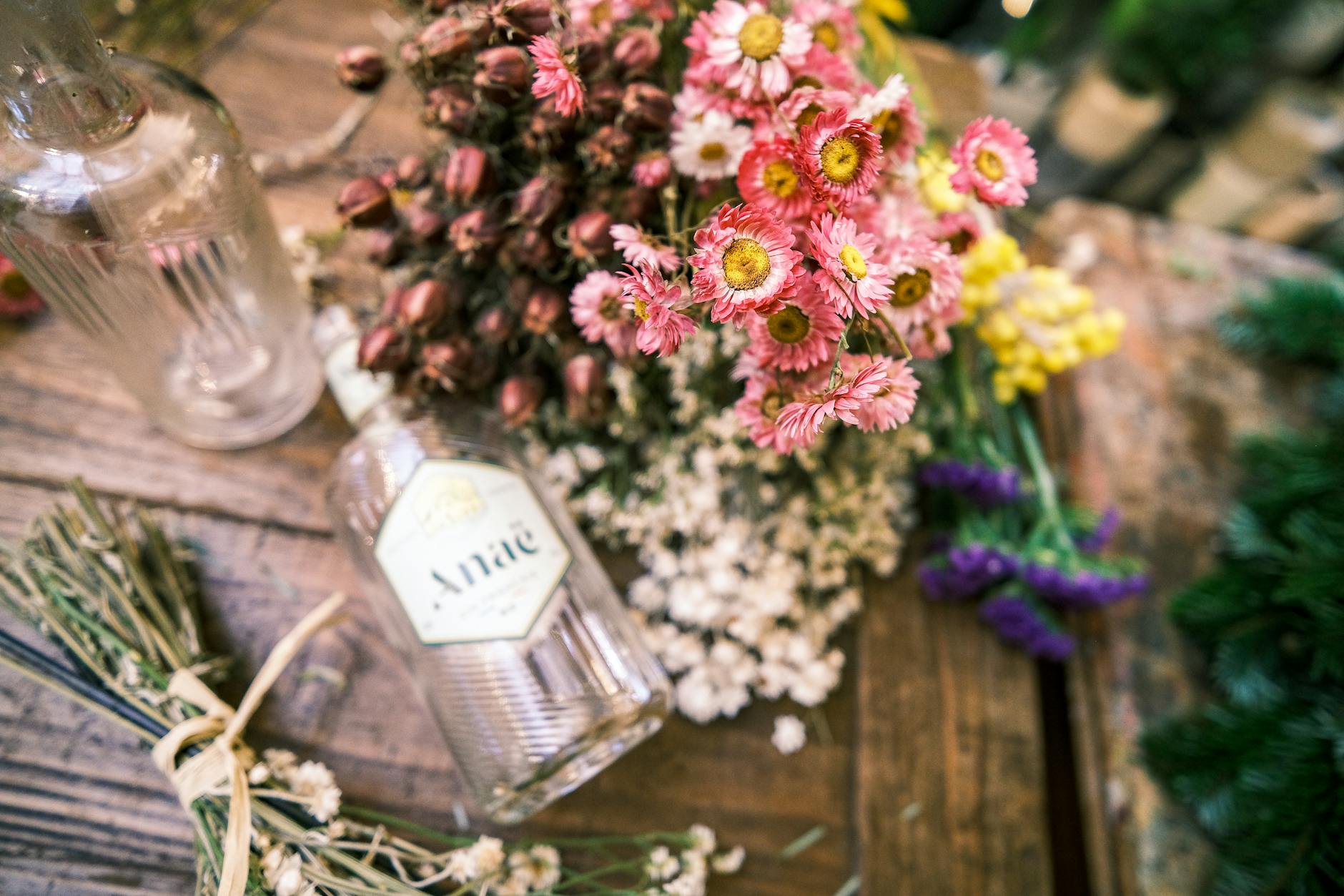 A vibrant floral display on a rustic wooden table in Paris, showcasing natural beauty.