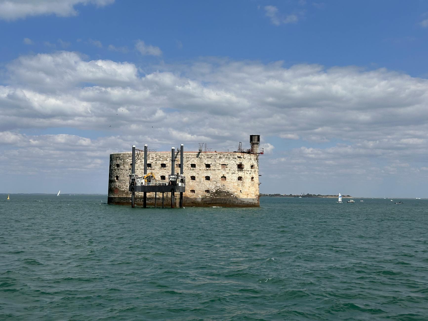 View of historic Fort Boyard, Charente-Maritime, surrounded by sea and sky.