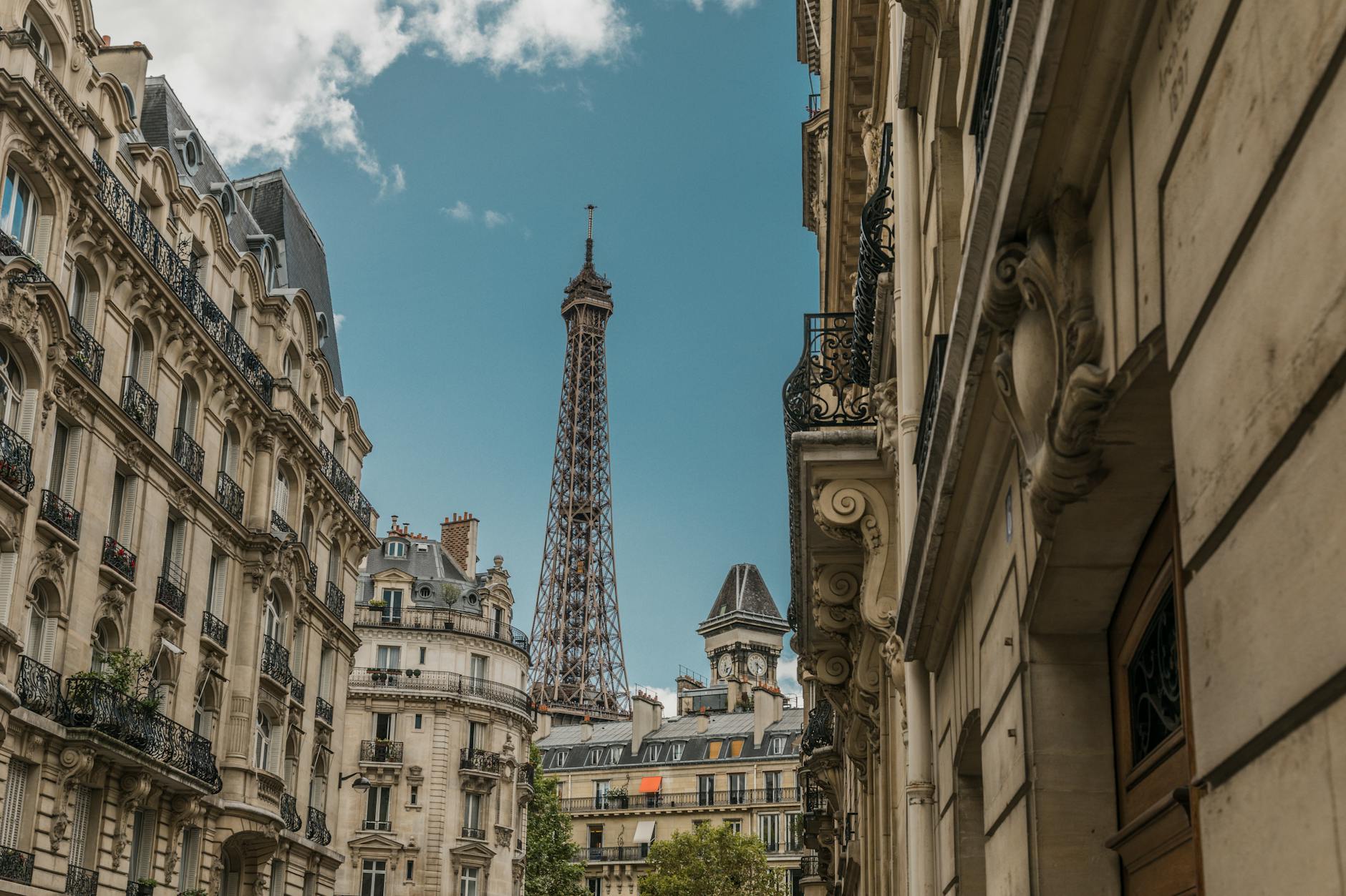 Capture the essence of Parisian architecture with the iconic Eiffel Tower in the background.
