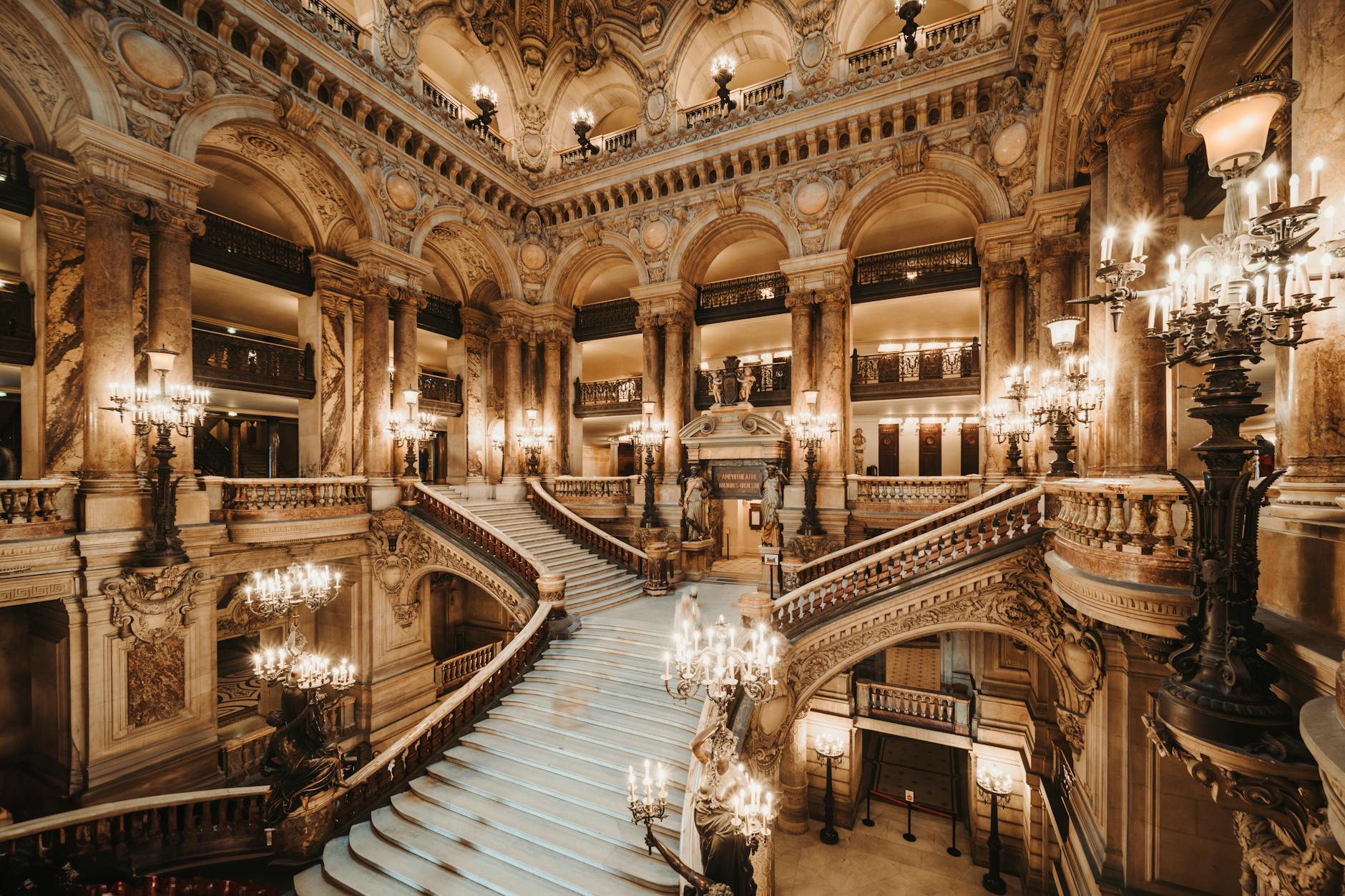 Interior view of the ornate Grand Staircase at the Opera Garnier in Paris, France.