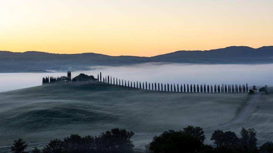 Rolling hills and cypress trees in Tuscany