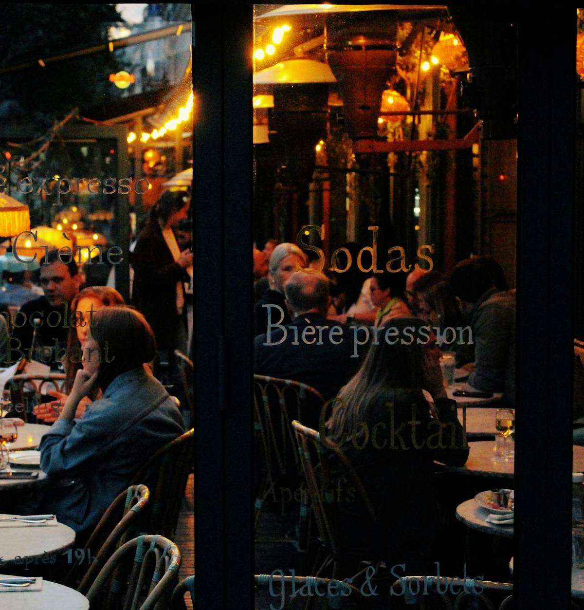 A warmly lit café after dark