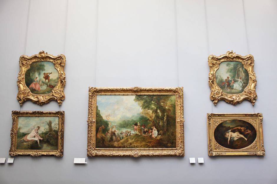 Paintings in an ornate museum gallery