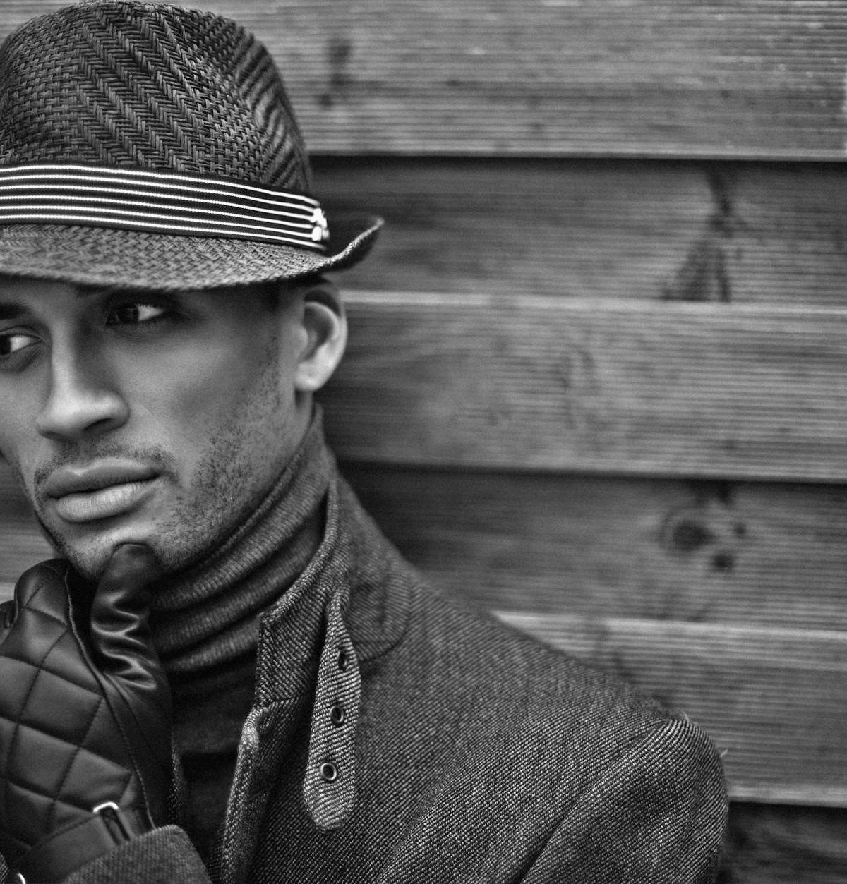 A man wearing a fedora, illustrative fashion photograph