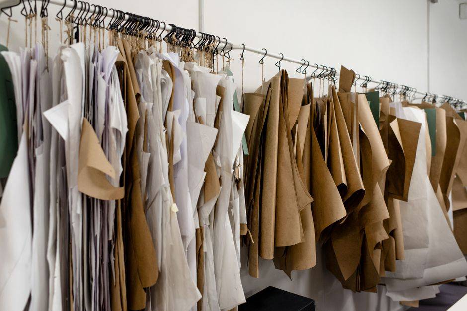 Garments and patterns in a fashion workspace, illustrative photograph