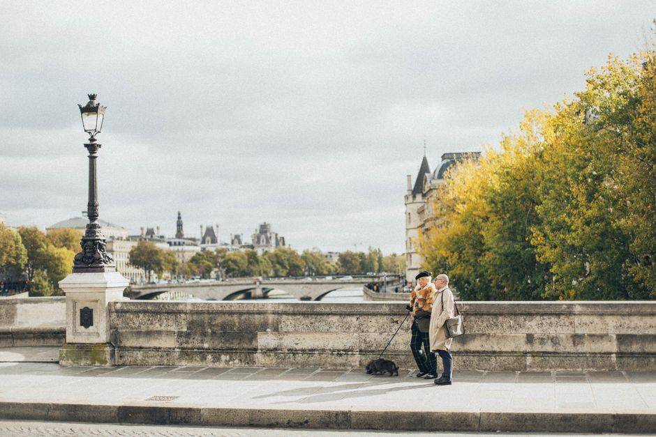 A couple on a Paris bridge