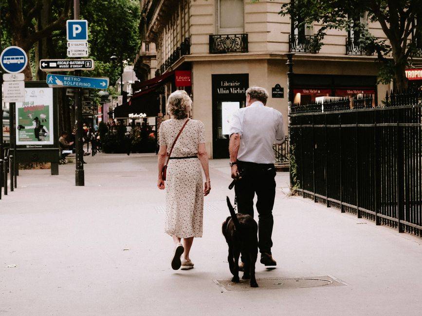 A couple walking along a Paris street