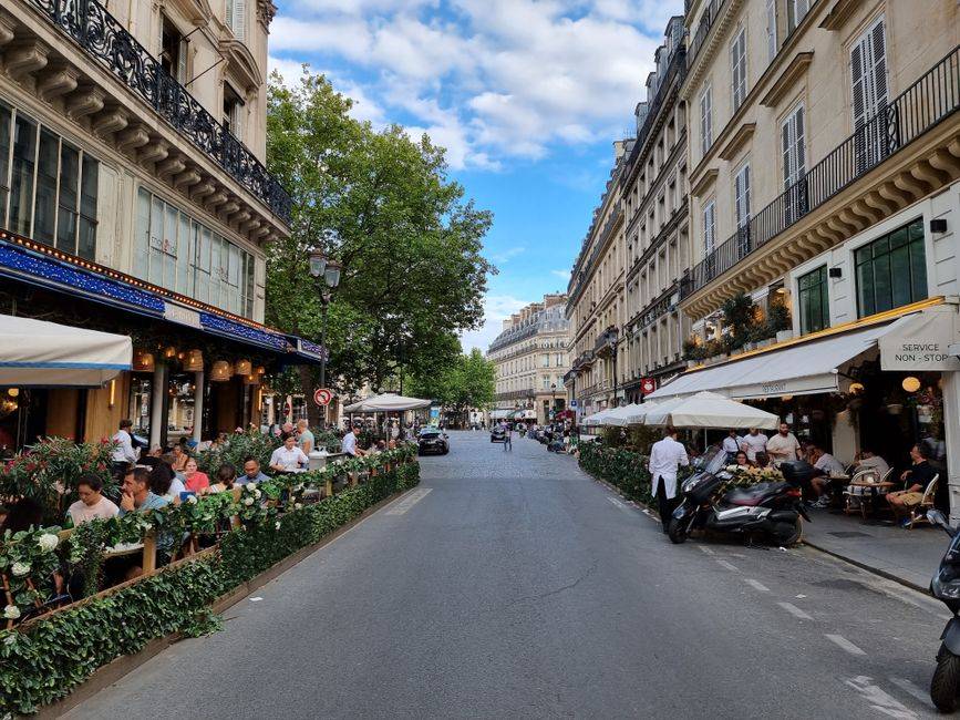 Restaurant terraces lining a Paris street