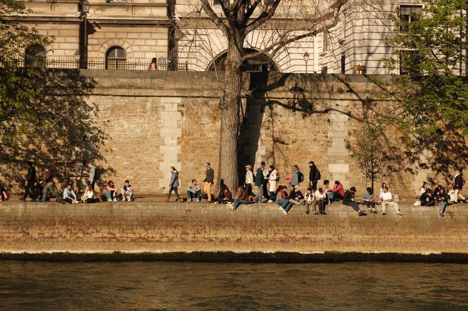 People relaxing along the Seine