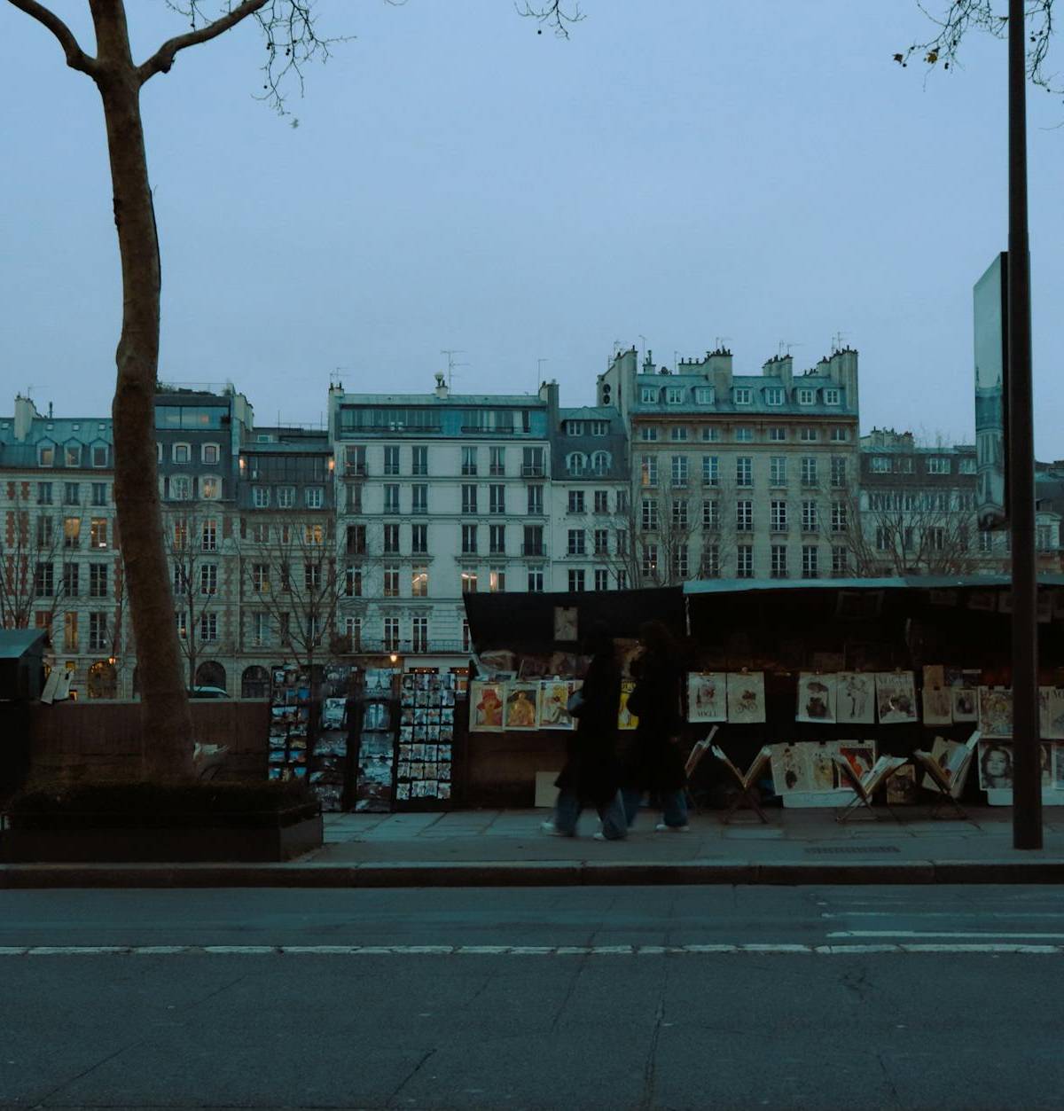 Booksellers’ stalls beside the Seine in evening light