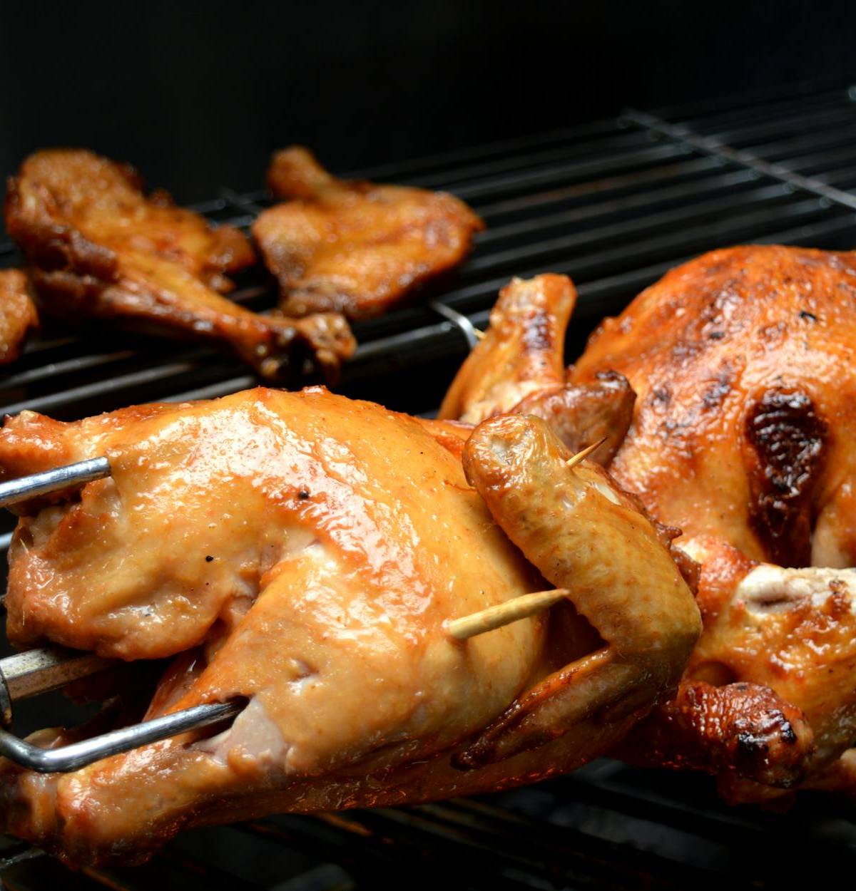Chickens turning on a rotisserie