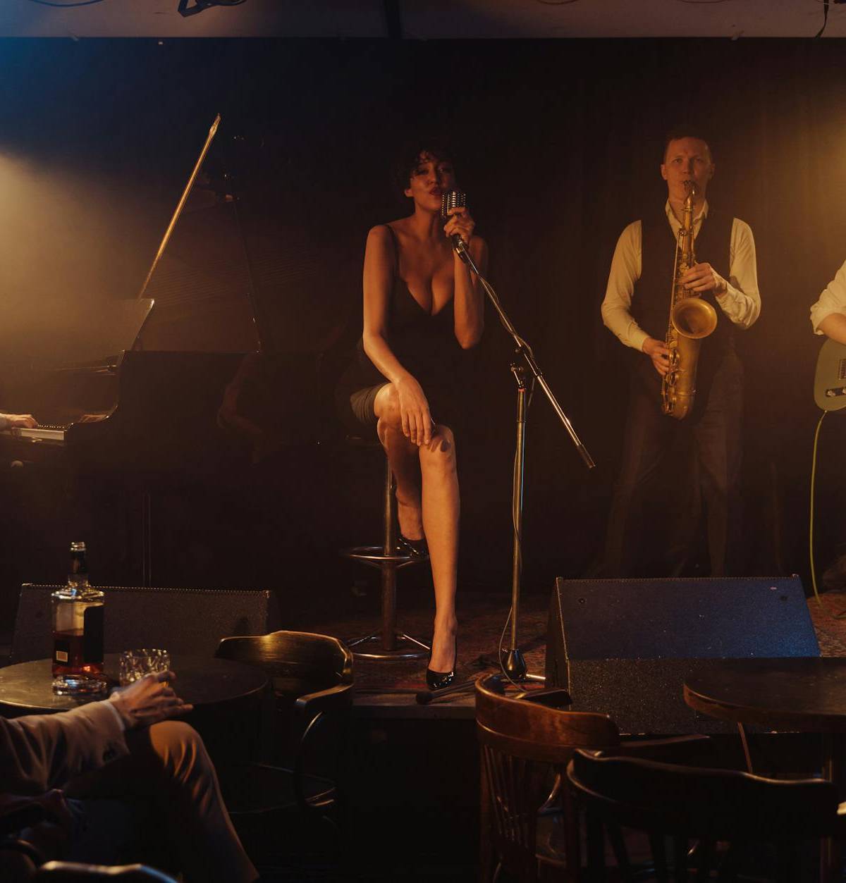 Musicians in a warmly lit jazz club, illustrative photograph
