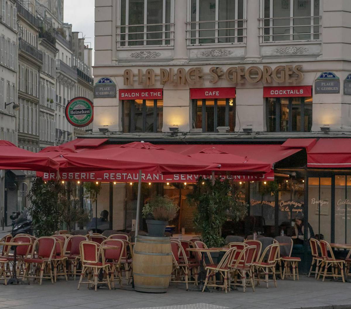 A restaurant with a red awning