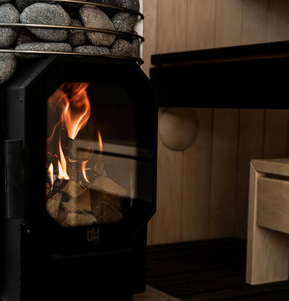 A wood-fired sauna stove, illustrative wellness photograph